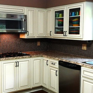 cabinet refacing---antique white w brown glaze, new countertops and backsplash