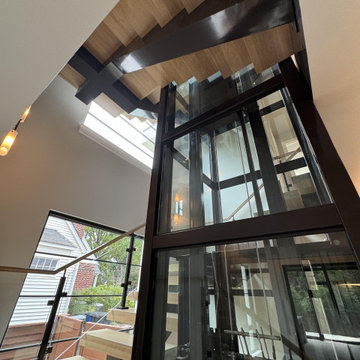 Project #136 | Modern Floating Staircase Encircling Glass Elevator