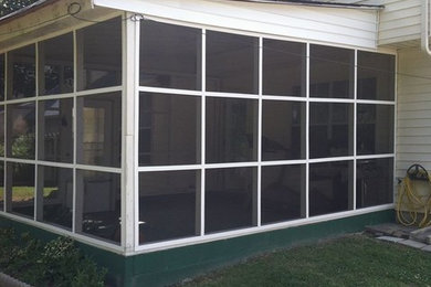 Mid-sized attached garage photo in Other