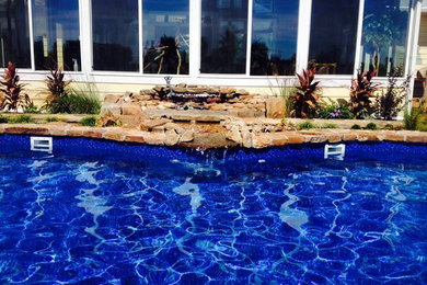 Inspiration for a tropical home design remodel in Miami