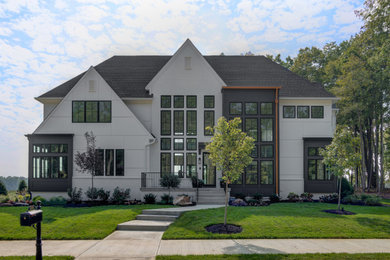 Large eclectic white two-story concrete fiberboard exterior home idea in Indianapolis with a shingle roof and a black roof