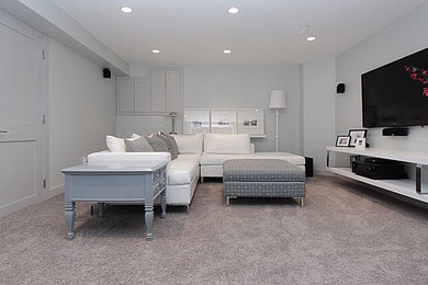 Home theater - mid-sized transitional open concept carpeted home theater idea in Calgary with gray walls and a wall-mounted tv