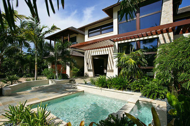 Inspiration for a tropical pool remodel in Other