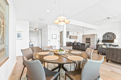 Inspiration for a mid-sized eclectic light wood floor great room remodel in Other with white walls, a standard fireplace and a tile fireplace