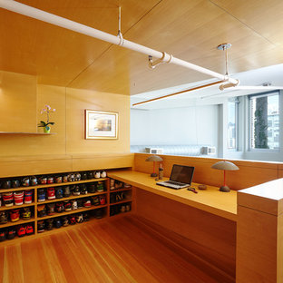 Photo of a modern study in Chicago with medium hardwood flooring and a built-in desk.