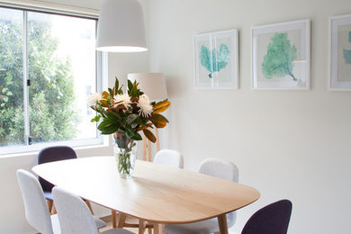 This is an example of a beach style dining room in Sydney.