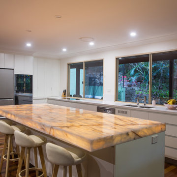 Contemporary kitchen with a stunning illuminated island bench