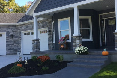 Example of a mid-sized classic blue two-story wood gable roof design in Other