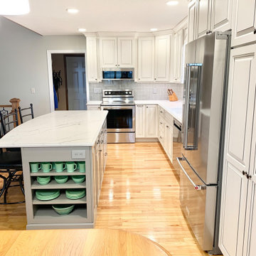 Two-Tone Kitchen Remodel With Single Level Island And Quartz Counters