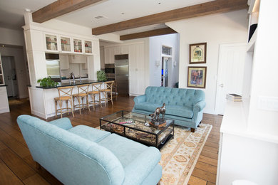 Inspiration for a large transitional open concept medium tone wood floor family room remodel in Phoenix with white walls and a media wall