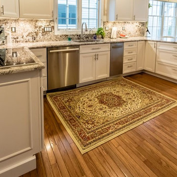 White cabinets with Bianco Antico Granite