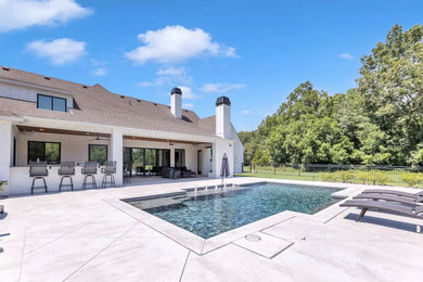 Spring Pool with Outdoor Kitchen and Covered Patio