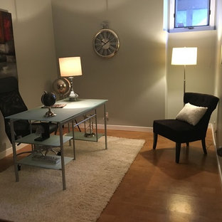 Photo of a modern study in Other with grey walls, cork flooring and a freestanding desk.