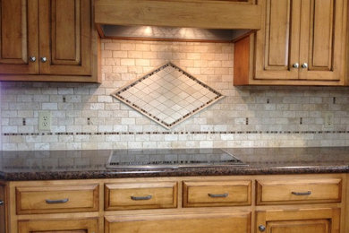 Kitchen - traditional kitchen idea in Other with beige backsplash and stone tile backsplash