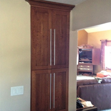 Omega Cabinetry. Plainfield door, Cherry wood, Nutmeg stain