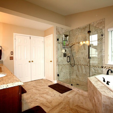 Master Bathroom with Frameless Shower and Jetted Tub