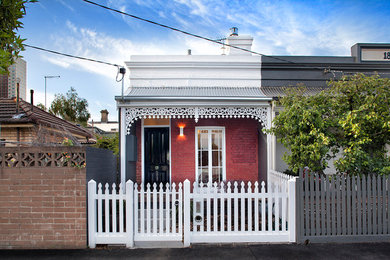 Design ideas for a traditional two-storey exterior in Melbourne.