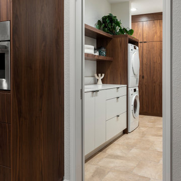Laundry Room with Walnut and White Cabinetry Off of Kitchen
