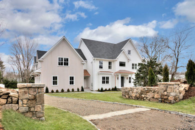 Large transitional white three-story mixed siding gable roof photo in New York