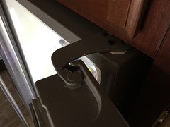 Help Refrigerator door swings too far