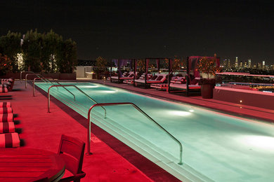 Inspiration for a large modern rooftop concrete and rectangular lap pool remodel in Los Angeles