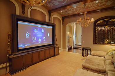 Inspiration for an enclosed home theatre in Tampa with a projector screen.