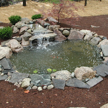 Front yard landscaping with back yard patio and pond