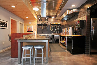 Inspiration for a mid-sized contemporary l-shaped concrete floor and brown floor kitchen remodel with granite countertops, multicolored backsplash, stainless steel appliances and an island
