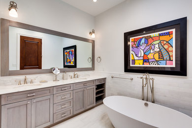 Mid-sized farmhouse master subway tile marble floor freestanding bathtub photo in Miami with shaker cabinets, gray cabinets, white walls and marble countertops