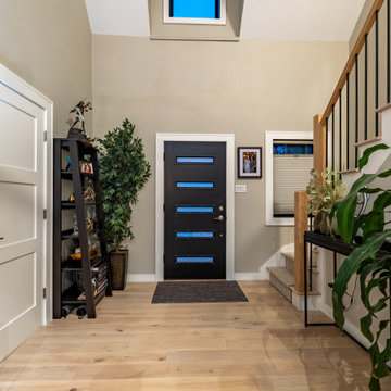 Open Staircase with Modern Railing and Light-Filled Entry – Cape Ann MA