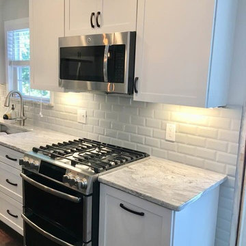White Kitchen with Grey Marble counter-tops