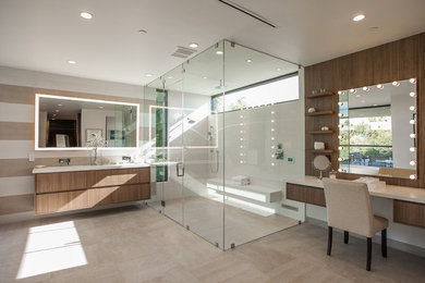 Walk-in shower - contemporary master brown tile and white tile beige floor walk-in shower idea in Los Angeles with flat-panel cabinets, medium tone wood cabinets, white walls and a hinged shower door
