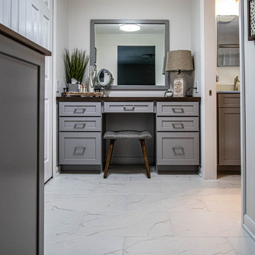Gray Bathroom with Tiled Shower and Make-Up Area