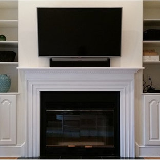 Inspiration for a small open concept home theater remodel in Charleston with white walls and a wall-mounted tv