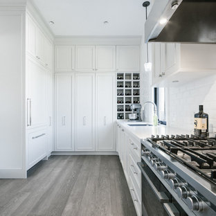 Mid-sized transitional kitchen pantry designs - Mid-sized transitional l-shaped light wood floor kitchen pantry photo in Vancouver