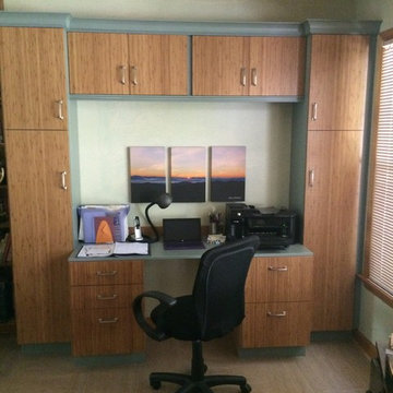 Bamboo doors and aqua cabinets make this study very appealing