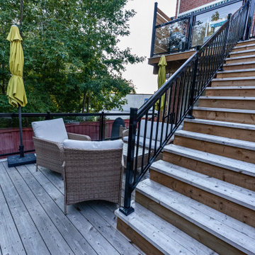 2024 Multi-Level Backyard Deck with Custom Railings and Seating Areas