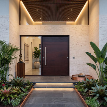 Beautiful Espresso Hurricane Resistant Pivot Door in Pinecrest, Florida.