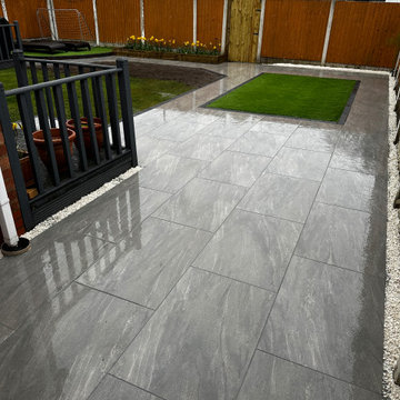 Wet Marbled Porcelain With a Grass Panel and Deck Steps