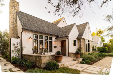 Mid-sized eclectic white two-story stucco exterior home idea in Los Angeles with a shingle roof