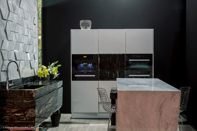 Example of a kitchen design in Other with white cabinets, granite countertops and black appliances