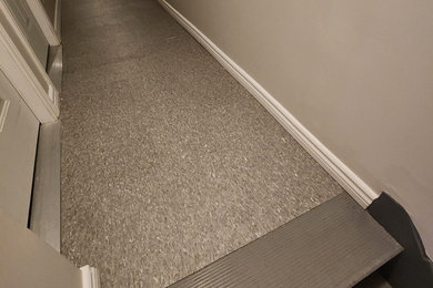 Mid-sized elegant vinyl floor and gray floor hallway photo in Other