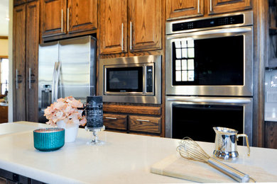 Mid-sized elegant kitchen photo in Other with quartzite countertops and an island