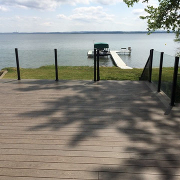 Wrap Around Composite Deck w/ Aluminum Frame-less Glass Railing in Seba Beach