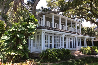 Inspiration for a large green two-story wood exterior home remodel in Tampa