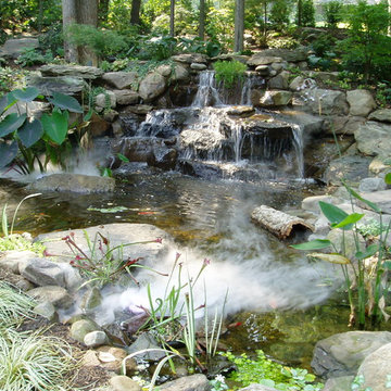 Grotto with pool house and running stream