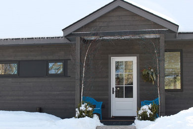 Inspiration for a mid-sized contemporary gray two-story wood exterior home remodel in Other with a shingle roof