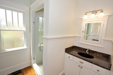 Small arts and crafts kids' black and white tile and ceramic tile dark wood floor bathroom photo in Atlanta with shaker cabinets, white cabinets and granite countertops