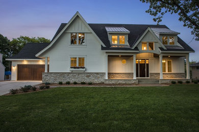 Example of a mid-sized white three-story gable roof design in Minneapolis