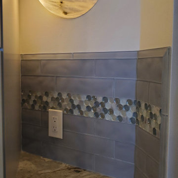 Backsplash with 3x12 textured glass and penny rounds
